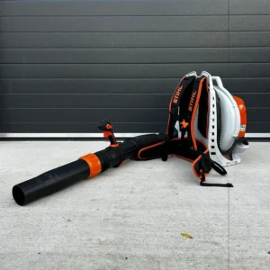 Backpack leaf blower with long black nozzle and orange accents