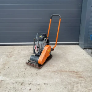 Plate compactor on a concrete surface