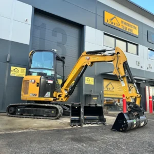 Yellow CAT mini excavator outside Warmister Tool Hire depot