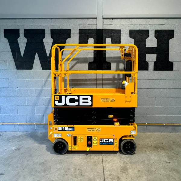 JCB electric scissor lift parked indoors